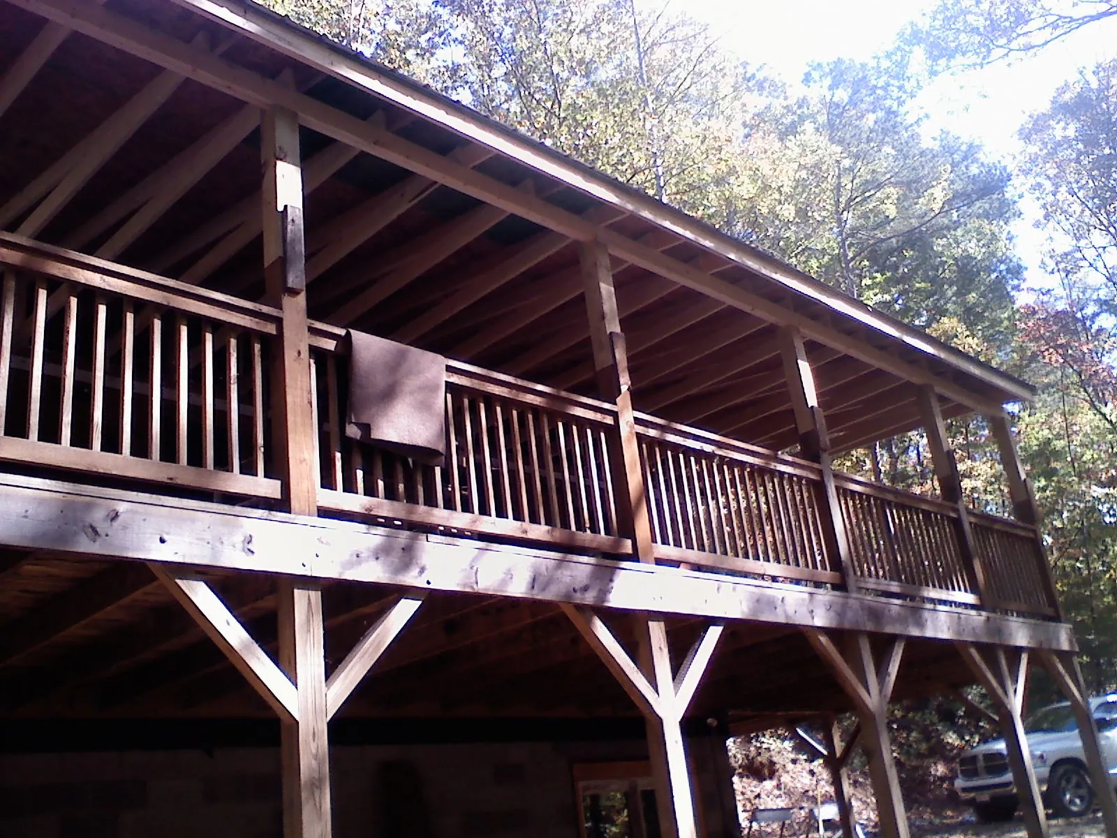 Timber framing under a new elevated porch and deck — Roof Leak Repair in Italy by Roofing Brothers